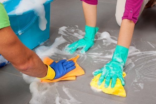 Technician inspecting a cleaned carpet area after a concern was raised