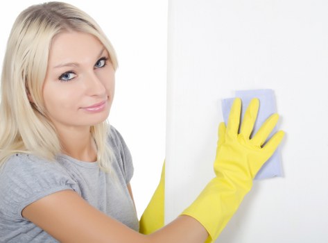Cleaner inspecting carpet condition before starting treatment