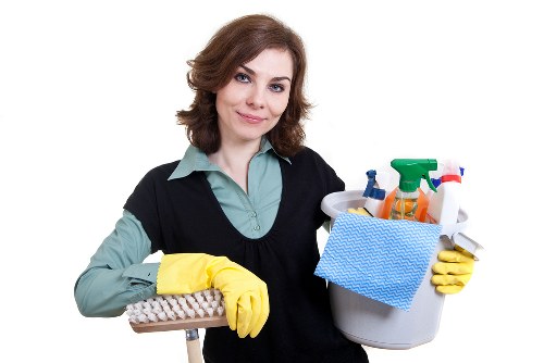 Professional carpet cleaner discussing a service issue with a customer
